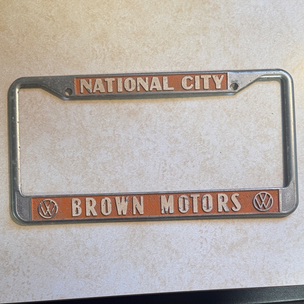 Vintage Authentic 1960s Brown Motors Volkswagen License Plate Frame.